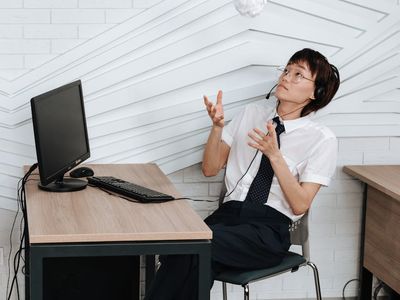 Professional sitting at desk thinking about relaxation